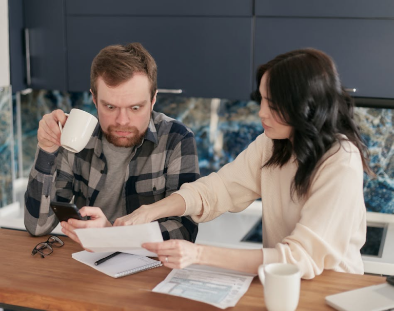family reviewing financial documents at a kitchen table