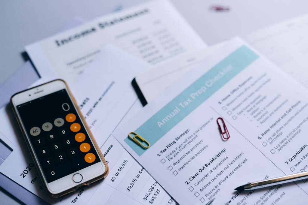 calculator and financial reports used for business tax planning