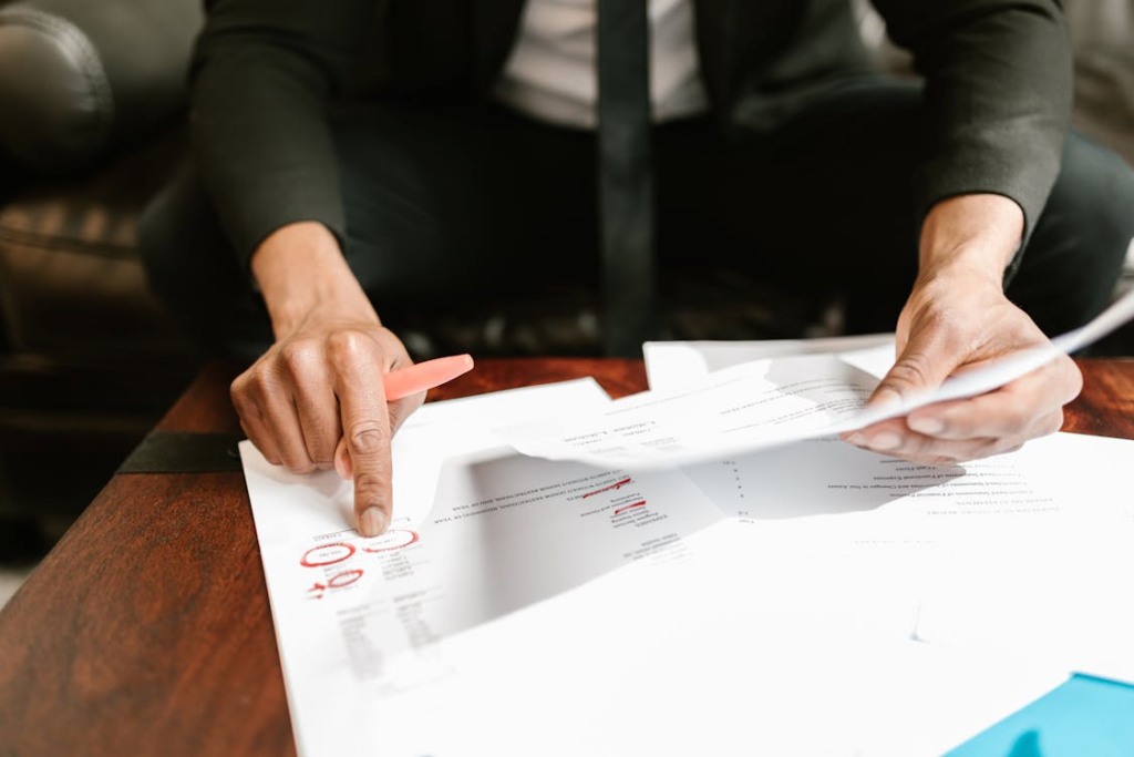 accountant reviewing tax documents and financial reports at a desk