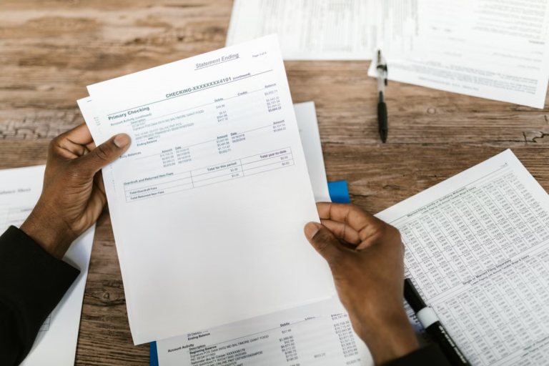 Taxpayer reviewing financial documents and preparing records before filing taxes